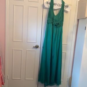 Green floor-length, halter neck gown. Size 12. JS collections.